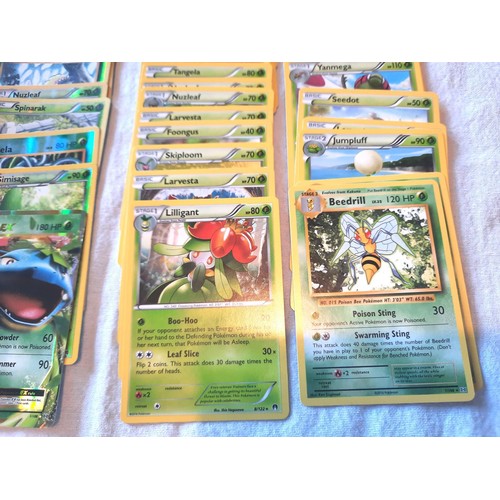 2130 - Collection of assorted Fire and Grass Pokemon trading cards including shiny / holographic examples; ... 