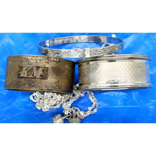 105 - Hallmarked silver childs bangle, necklace and bracelet set and two hallmarked silver napkin rings, c... 