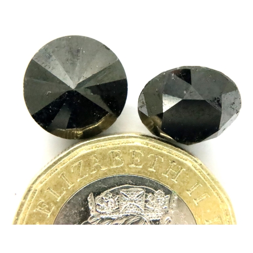 109 - Two loose AIG certified black diamonds, each over 4cts. P&P Group 1 (£14+VAT for the first lot and £... 