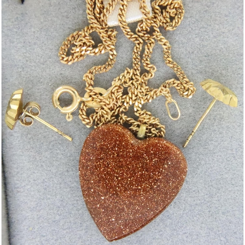 12 - Goldstone heart pendant on 9ct gold chain and a pair of earrings, chain L: 41 cm, combined 3.3g. One... 