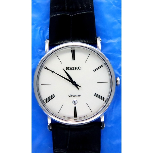 126 - Seiko; gents Premier stainless steel wristwatch with white dial, date aperture at six, boxed, as new... 