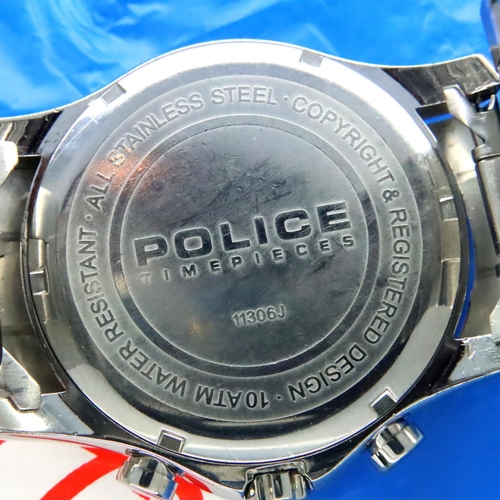 128 - Police; gents stainless steel wristwatch with blue bezel and black dial, working at lotting. P&P Gro... 