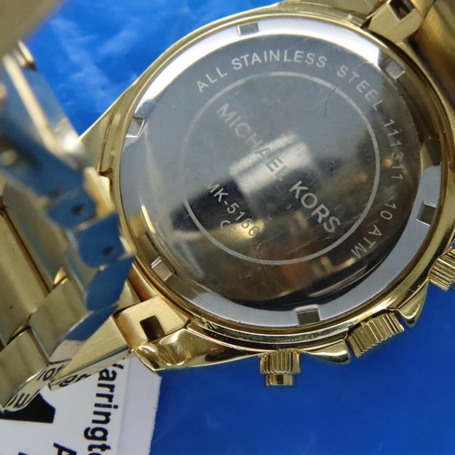 130 - Michael Kors; gents gold plated wristwatch with diamond style bezel, working at lotting. P&P Group 1... 