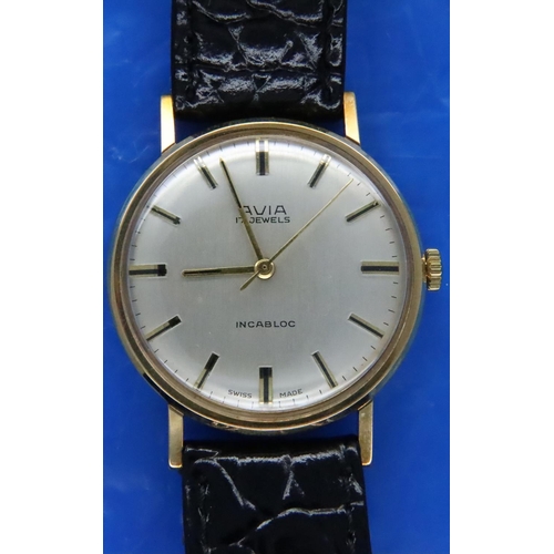 131 - Avia; gents 9ct gold mechanical wristwatch with champagne dial, black leather strap in original box,... 