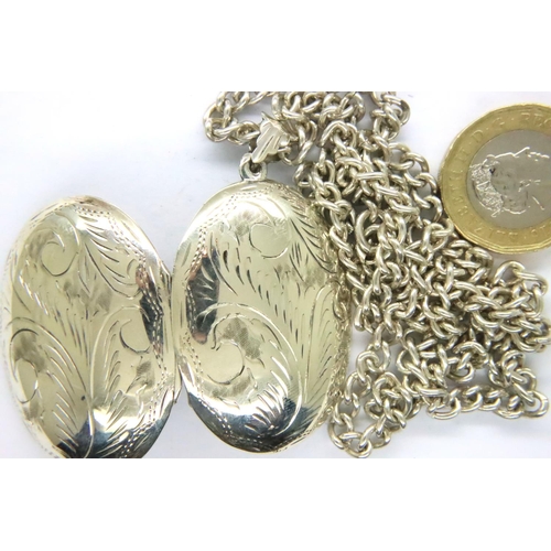 23 - 925 silver locket and neck chain. Pendant H: 4 cm, chain L: 58 cm. P&P Group 1 (£14+VAT for the firs... 