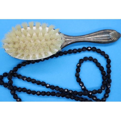 168 - Presumed silver baby hairbrush and a string of beads. P&P Group 1 (£14+VAT for the first lot and £1+... 