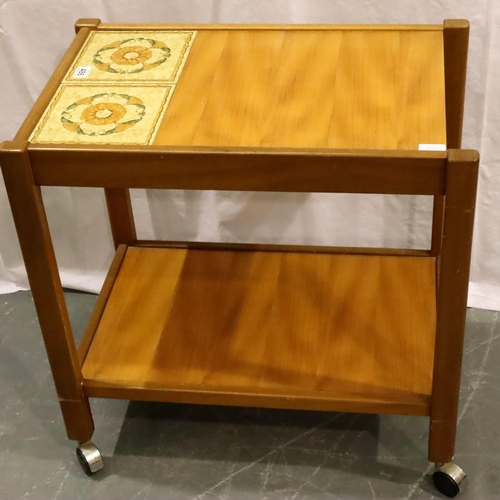 486 - Nathan teak tea trolley with tile inset top and raised on castors, 71 x 46 x 71 cm H. Not available ... 