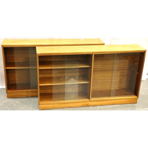 490 - Pair of Mid 20th century teak bookcases, each with twin glass sliding doors and adjustable shelves, ... 