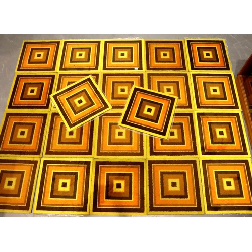 492 - Twenty two 1970s square target carpet tiles in yellow, brown and orange including unused examples, e... 