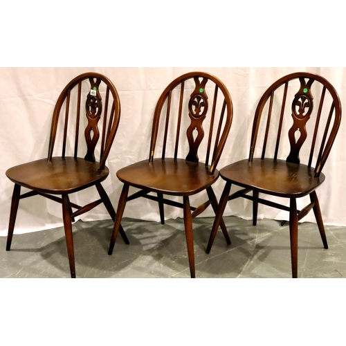 493 - Three Ercol dark elm dining chairs. Condition report: some heavy surface wear and scratches througho... 