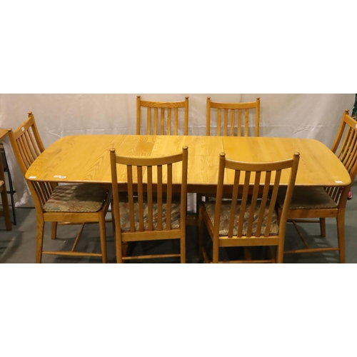 500 - Ercol Windsor golden elm extending dining table with central folding leaf and a set of six stick bac... 