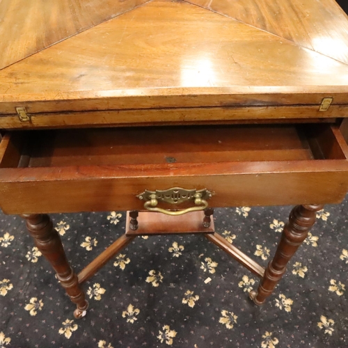 469 - Edwardian walnut games table, the top with swivel and envelope-fold action, green baize and single d... 