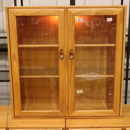 482 - Ercol Windsor light elm amalgamated wall unit of two small sideboards and a glazed two door display ... 