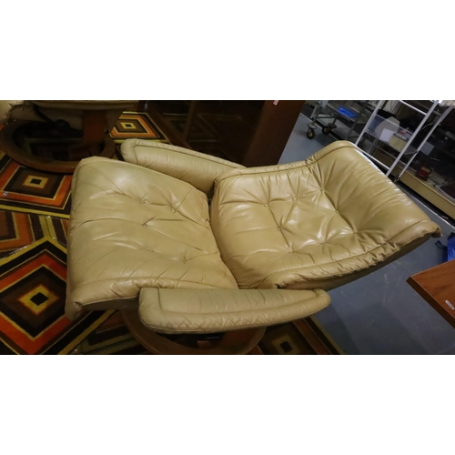 491 - Two Ekornes Stressless biscotti leather reclining chairs and a matching footstool. Some wear to leat... 