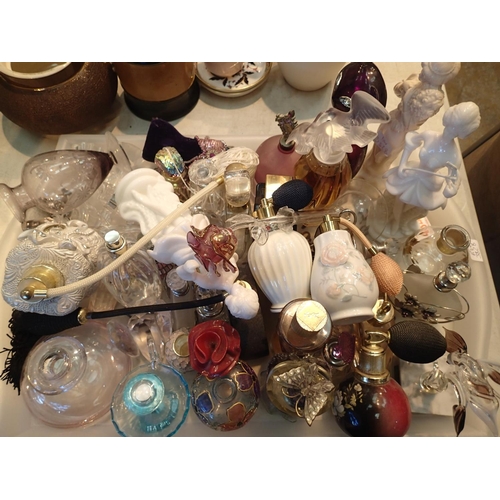 1320 - Large collection of glass and ceramic perfume bottles and atomisers, some with contents. Not availab... 