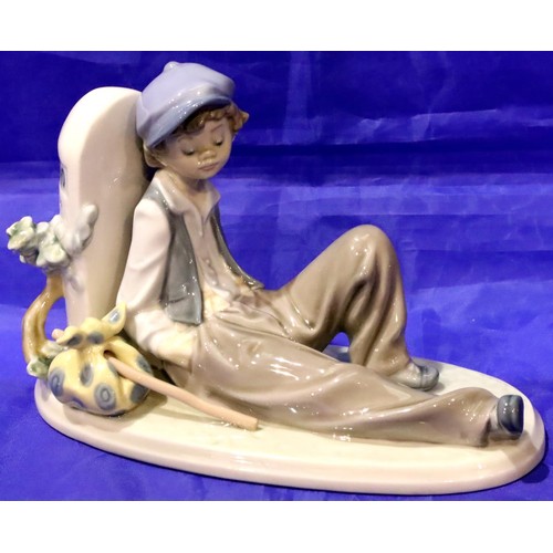 177 - Lladro figurine of a boy leaning against a milestone, no chips, cracks or visible restoration. P&P G... 