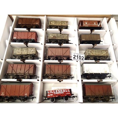 2102 - Fifteen OO scale wagons, various types and makes, mostly weathered in Warley storage box. P&P Group ... 