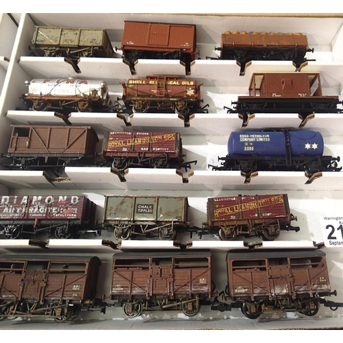 2107 - Fifteen OO scale wagons, various types and makes, mostly  weathered in Warley storage box. P&P Group... 