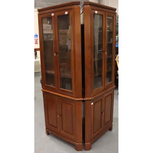 505 - A pair of floor standing corner cupboards, each having a single glazed door with internal shelves, e... 