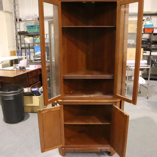 505 - A pair of floor standing corner cupboards, each having a single glazed door with internal shelves, e... 