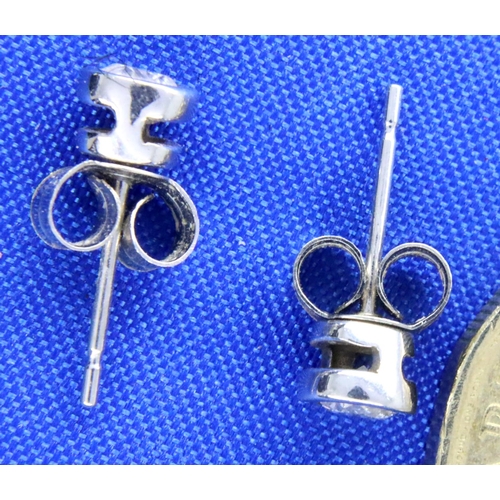 21 - Pair of 9ct white gold diamond set earrings, 0.9g. P&P Group 1 (£14+VAT for the first lot and £1+VAT... 