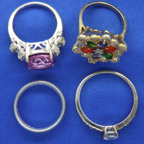 34 - Four sterling silver rings including three stone set. P&P Group 1 (£14+VAT for the first lot and £1+... 