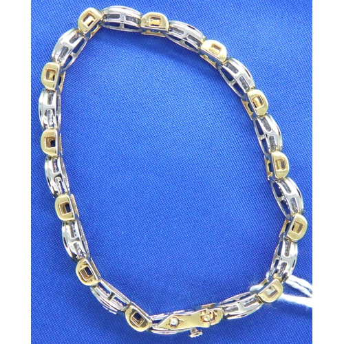 45 - 14ct white and yellow gold bracelet set with baguette cut diamonds, L: 18 cm, 18.4g. Good condition,... 