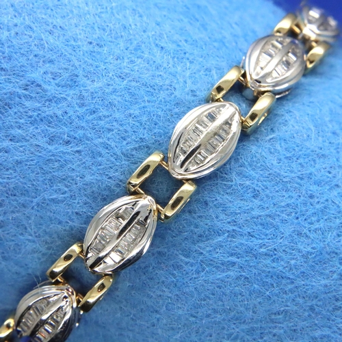 45 - 14ct white and yellow gold bracelet set with baguette cut diamonds, L: 18 cm, 18.4g. Good condition,... 