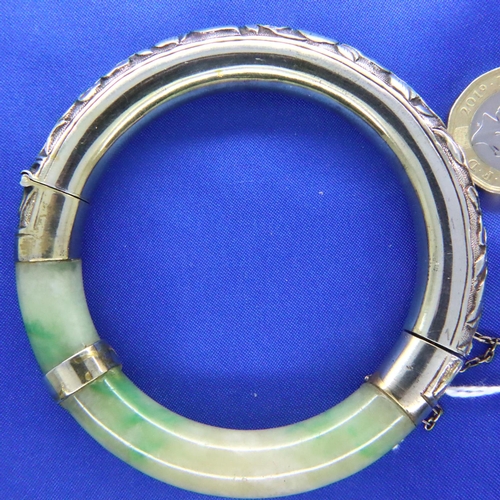 54 - Heavy jade and 925 silver ornate bangle, D: 43 mm, 57g. P&P Group 1 (£14+VAT for the first lot and £... 