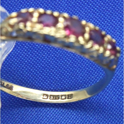 60 - 9ct gold ruby set ring, size S/T, 1.6g. P&P Group 1 (£14+VAT for the first lot and £1+VAT for subseq... 