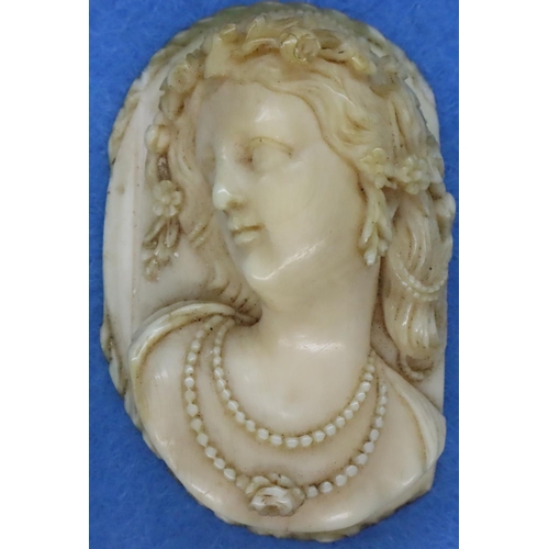 44 - Carved ivory female portrait, unmounted, H: 7 cm. P&P Group 1 (£14+VAT for the first lot and £1+VAT ... 