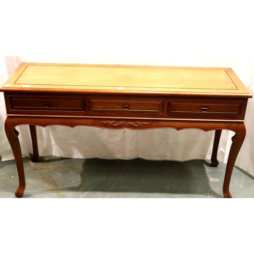 503 - A contemporary three drawer console table in Oriental hardwood with carved hand pulls, 152 x 52 x 84... 