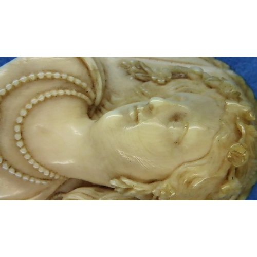 44 - Carved ivory female portrait, unmounted, H: 7 cm. P&P Group 1 (£14+VAT for the first lot and £1+VAT ... 