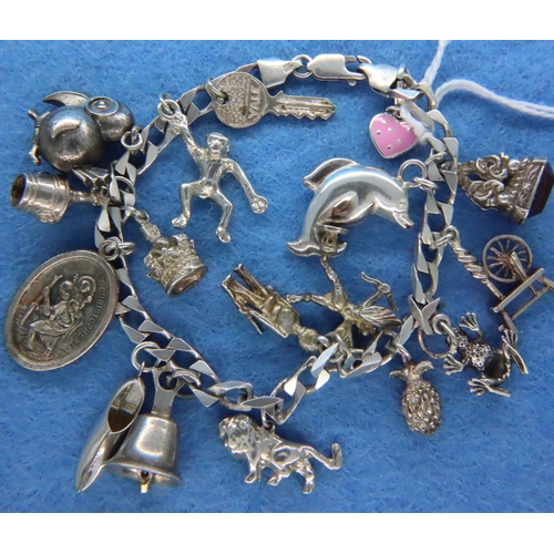 68 - 925 silver charm bracelet, 17 charms, L: 21 cm. P&P Group 1 (£14+VAT for the first lot and £1+VAT fo... 