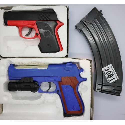 3081 - Two boxed airsoft pistols and an airsoft assault rifle magazine. P&P Group 1 (£14+VAT for the first ... 