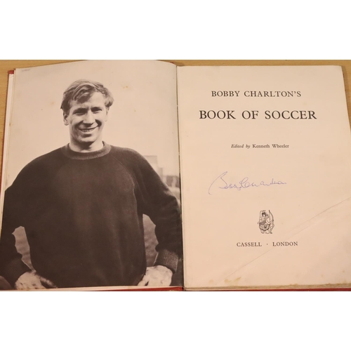 3112 - Bobby Charlton book of football with signature opposite portrait page. (book in fair condition with ... 