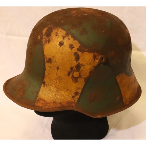 3143 - WWI 1916 German Stahlhelm helmet, painted in jigsaw pattern camouflage, complete with leather liner.... 