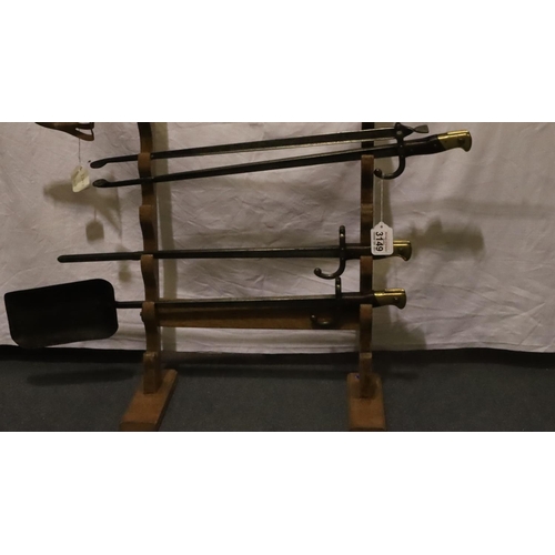 3149 - A three piece fireside companion set formed from four French WWI Gras bayonets, comprising poker, sh... 