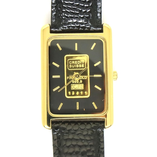 121 - Swiss wristwatch, the black rectangular dial set with a fine gold ingot. P&P Group 1 (£14+VAT for th... 