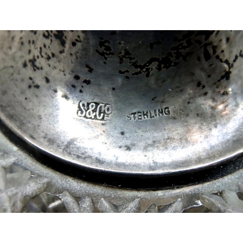 149 - Two hallmarked silver napkin rings and a silver topped glass perfume atomiser. P&P Group 2 (£18+VAT ... 