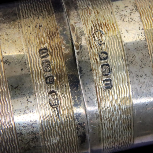 149 - Two hallmarked silver napkin rings and a silver topped glass perfume atomiser. P&P Group 2 (£18+VAT ... 