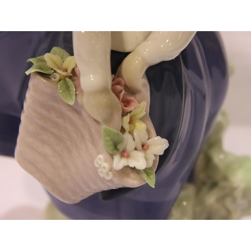 182 - Lladro figurine girl with posy, a further Lladro girl with a chamberstick and a Nao girl, H: 26 cm. ... 