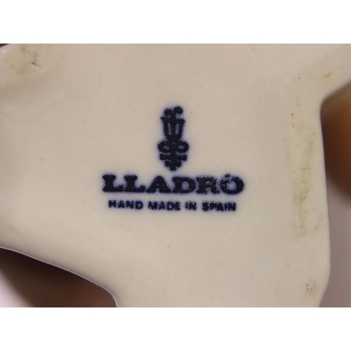 182 - Lladro figurine girl with posy, a further Lladro girl with a chamberstick and a Nao girl, H: 26 cm. ... 