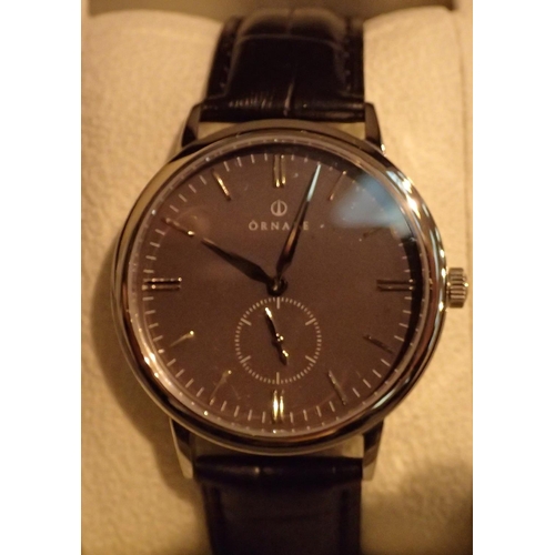1120 - New old stock Ornake silver and black boxed gents wristwatch, with second hand and leather strap. P&... 