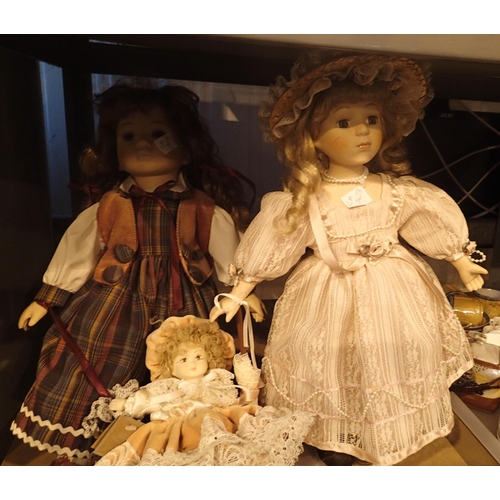 1150 - Three porcelain dolls, two with stands. Not available for in-house P&P, contact Paul O'Hea at Mailbo... 