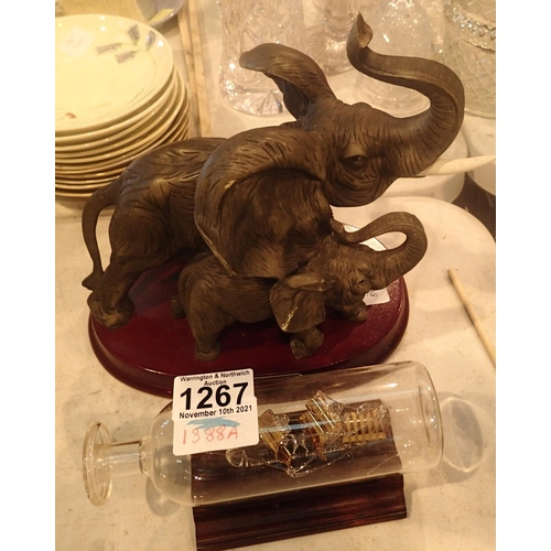 1267 - Juliana collection Elephant and Calf and a glass ship in bottle on wooden plinth. Not available for ... 