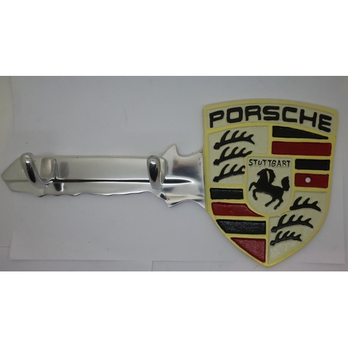 1124A - Cast iron Porsche key wall coat hanger, L: 30 cm. P&P Group 2 (£18+VAT for the first lot and £3+VAT ... 