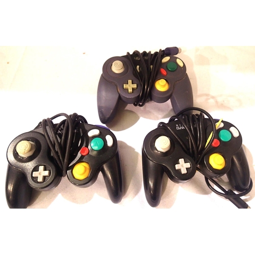 2181 - Two Nintendo GameCube controllers and one aftermarket controller. P&P Group 1 (£14+VAT for the first... 