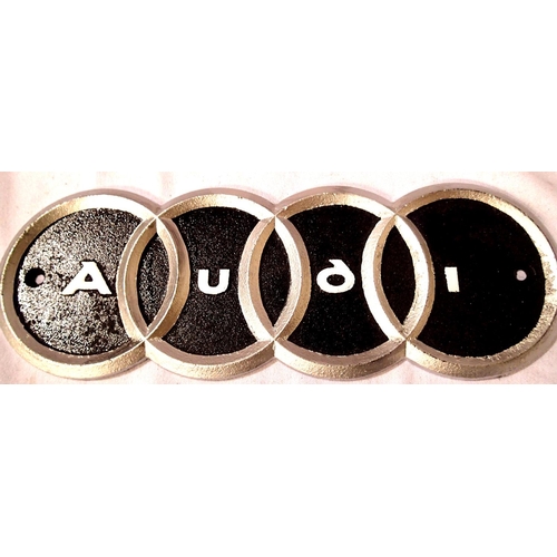 2184 - Cast iron Audi sign, L: 30 cm. P&P Group 1 (£14+VAT for the first lot and £1+VAT for subsequent lots... 