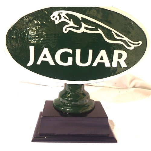 2199 - Green cast Jaguar sign on wooden base, 35 x 39 cm. P&P Group 3 (£25+VAT for the first lot and £5+VAT... 